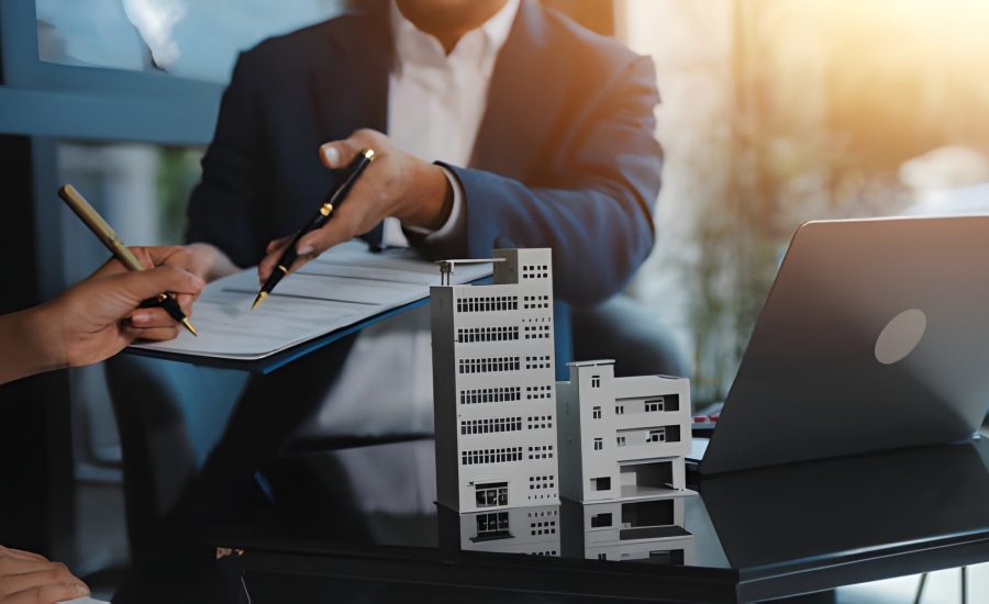 Construction loan consultation in Florida with professionals reviewing building plans and financial documents