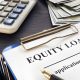 Hard equity lenders—equity loan application with cash, calculator, and clipboard on dark wooden desk