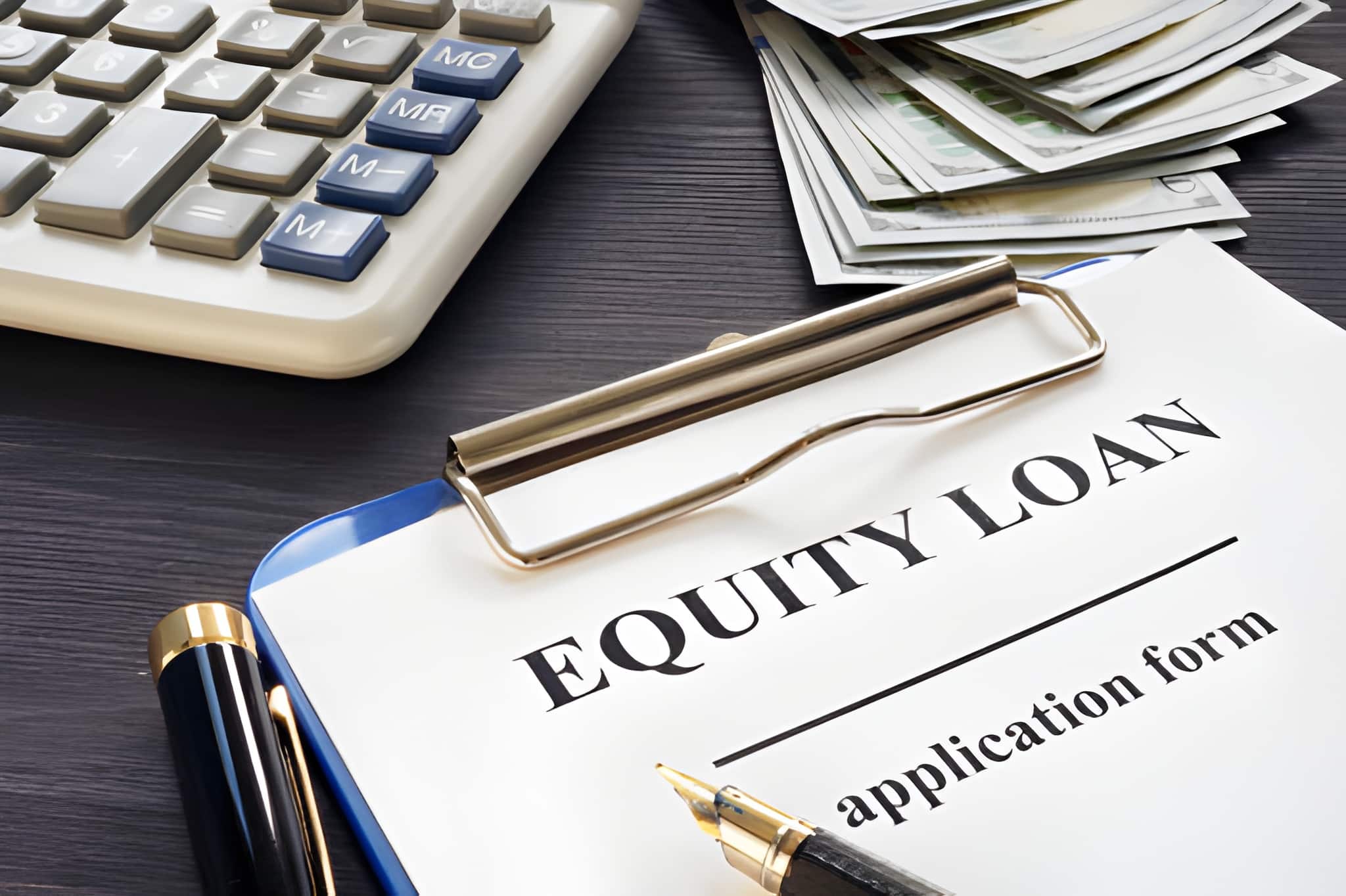 Hard equity lenders—equity loan application with cash, calculator, and clipboard on dark wooden desk