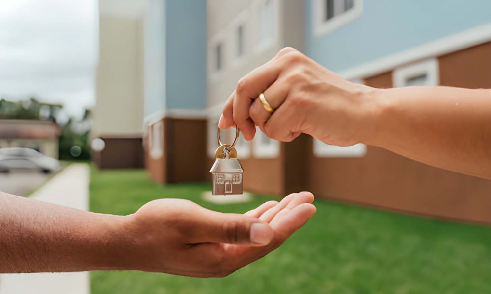 Key handoff representing commercial real estate loan closing in Florida with modern building in background