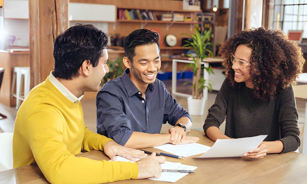 Florida construction loan team discussing project financing options in modern office setting